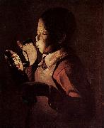Georges de La Tour Knabe blast in eine Lampe oil painting